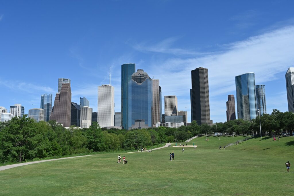 Houston, texas skyline is visible on a sunny day.